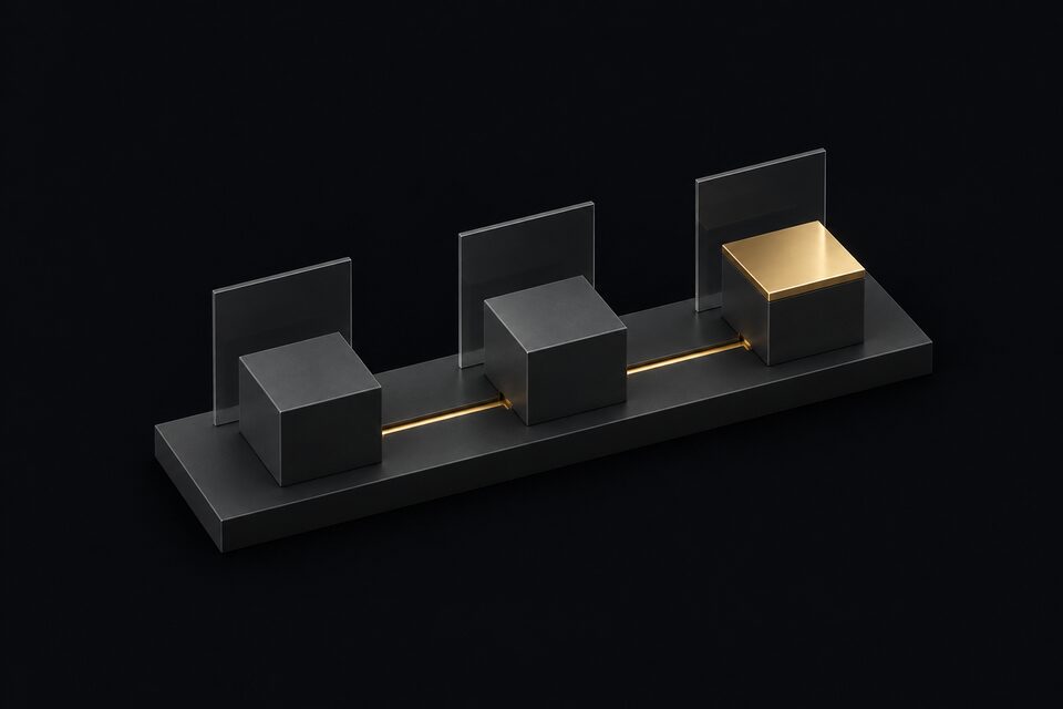 Three identical graphite blocks in a row, linked by one brass line to a brass-capped last block