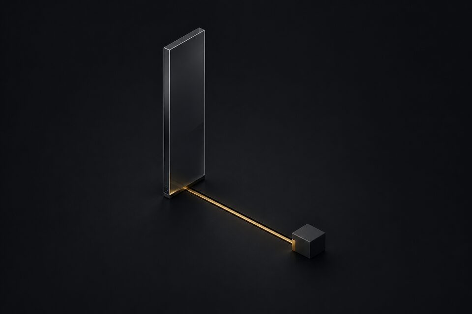 A tall vertical glass slab already wired by a brass line to a small terminal block