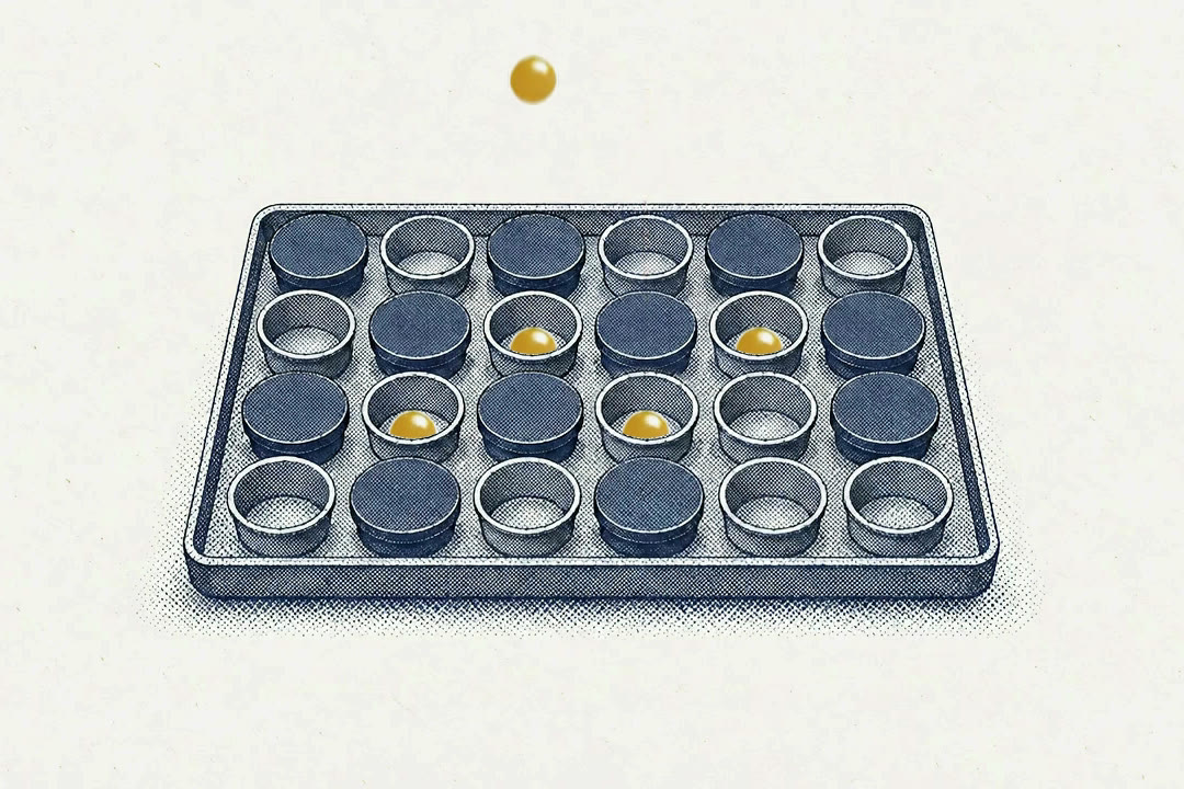 Brass balls drop only into the open cups of a tray, while the cups with lids stay closed